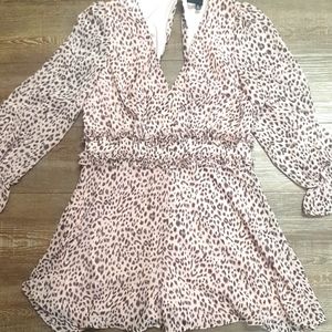 New long sleeve romper. Pink and brown cheetah. Never worn